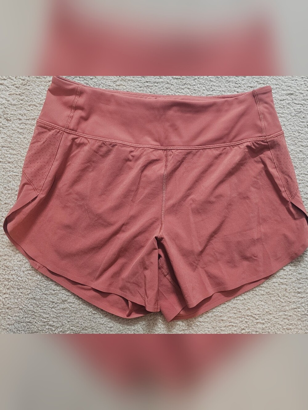 Athleta running shorts coral color feature a wide waistband and a side tag. Smal - Picture 2 of 8
